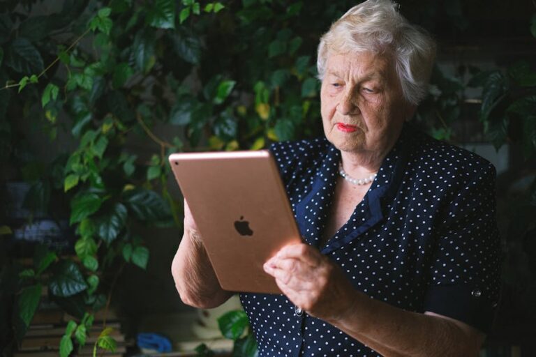 elderly woman using tablet home - Photo by Anna Shvets on Pexels
