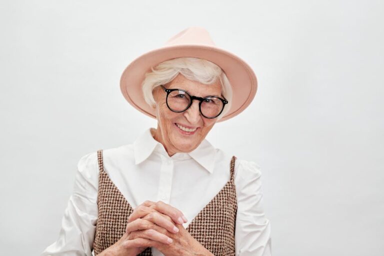 senior woman smiling smart home speaker - Photo by Moe Magners on Pexels