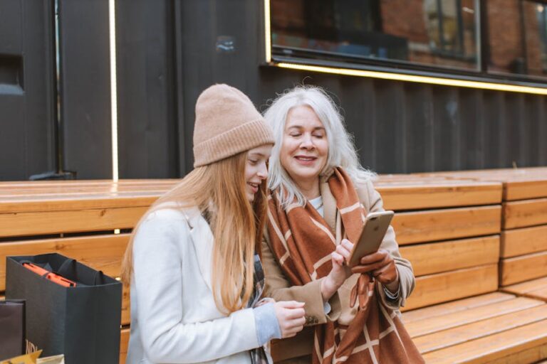 adult child helping elderly parent smartphone - Photo by Anastasia Shuraeva on Pexels